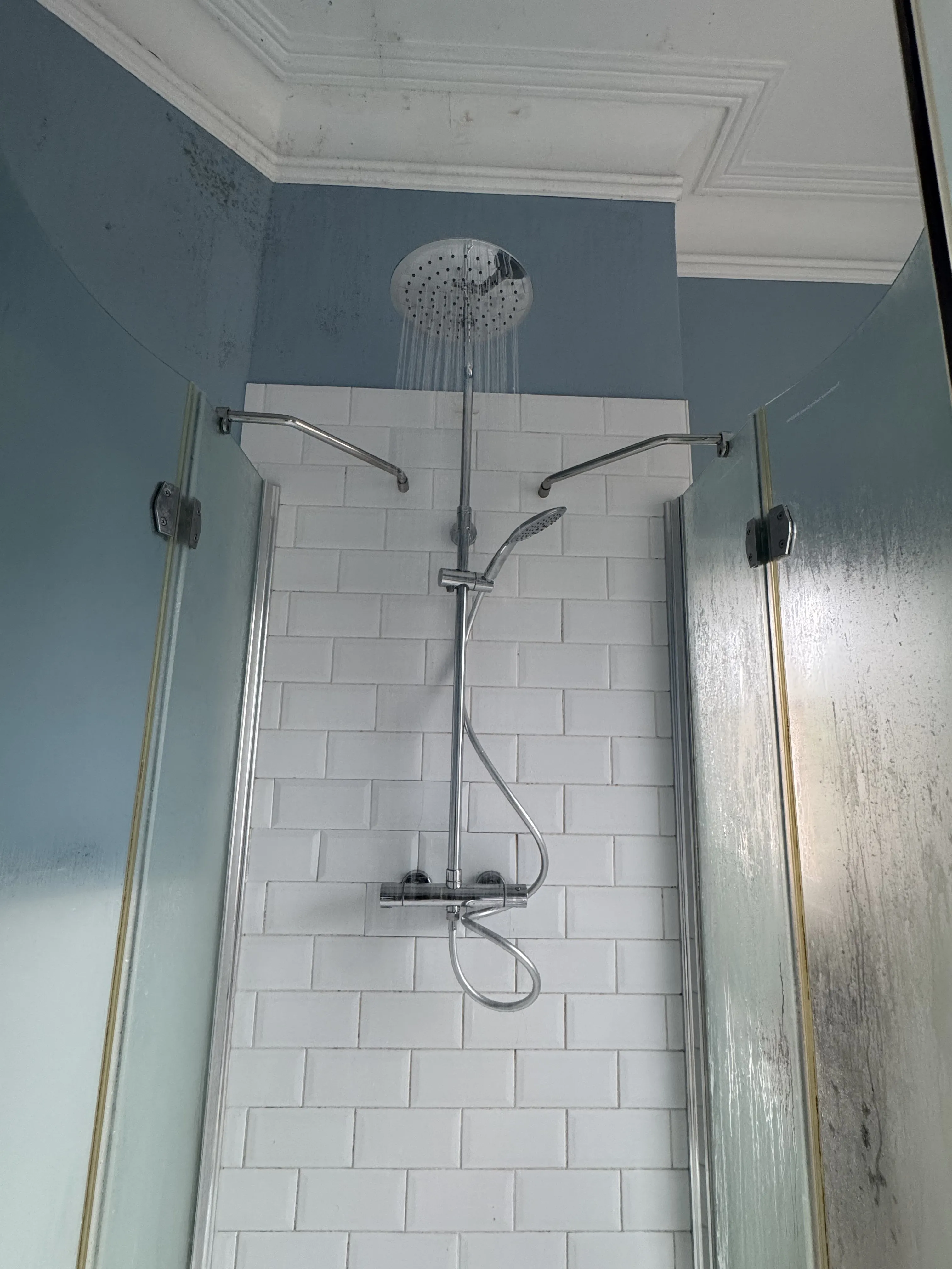 Rainfall shower installation with white metro tiles